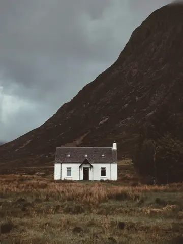 Cottage by a mountain