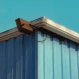 Blue building with an exterior light
